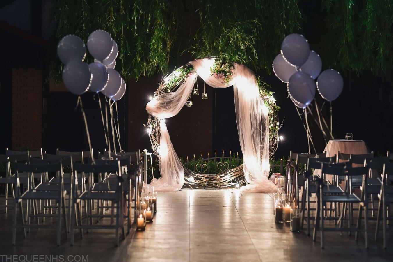 shine wedding altar newlyweds stands backyard decorated with balloons
